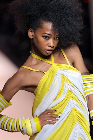 Illustration for article titled Jean-Paul Gaultier: Brights, Bras, Bellies, And Braids